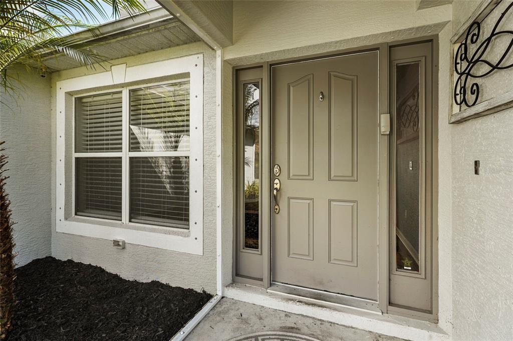 15105 Gulistan Avenue Port Charlotte, FL 33953 - Photo 8 of 39 a view of a door and a window