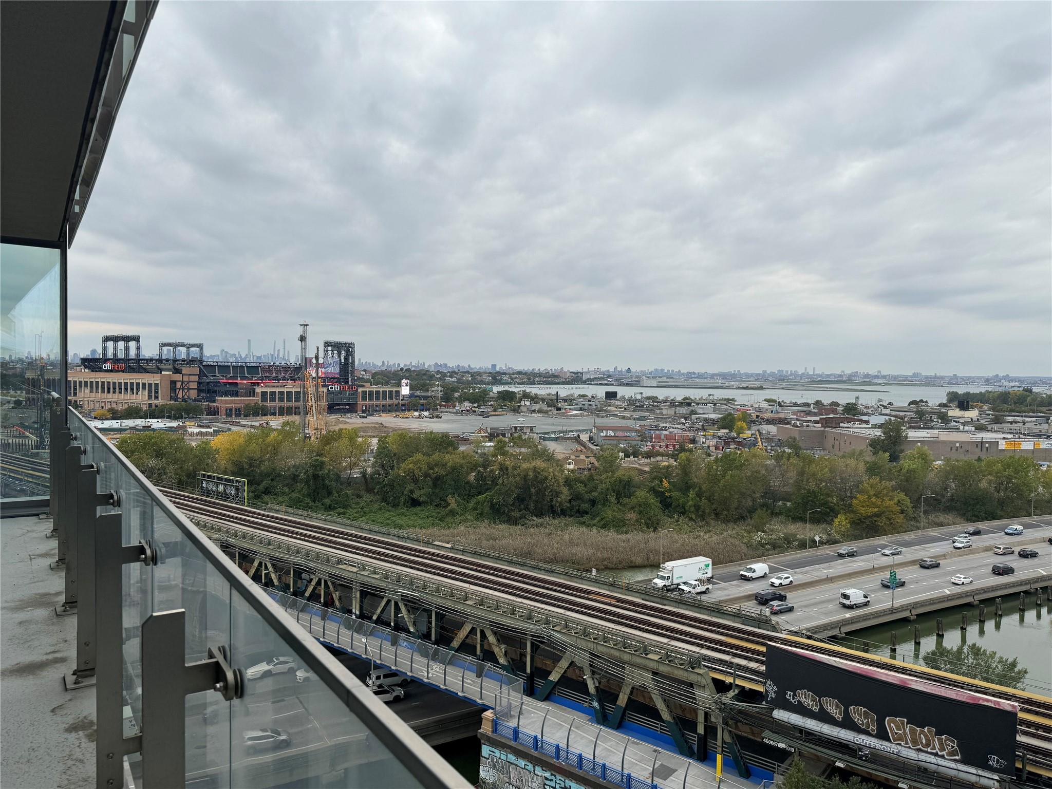 131-01 40 Road, Unit 11M Queens, NY 11354 - Photo 5 of 12 a city view from a balcony