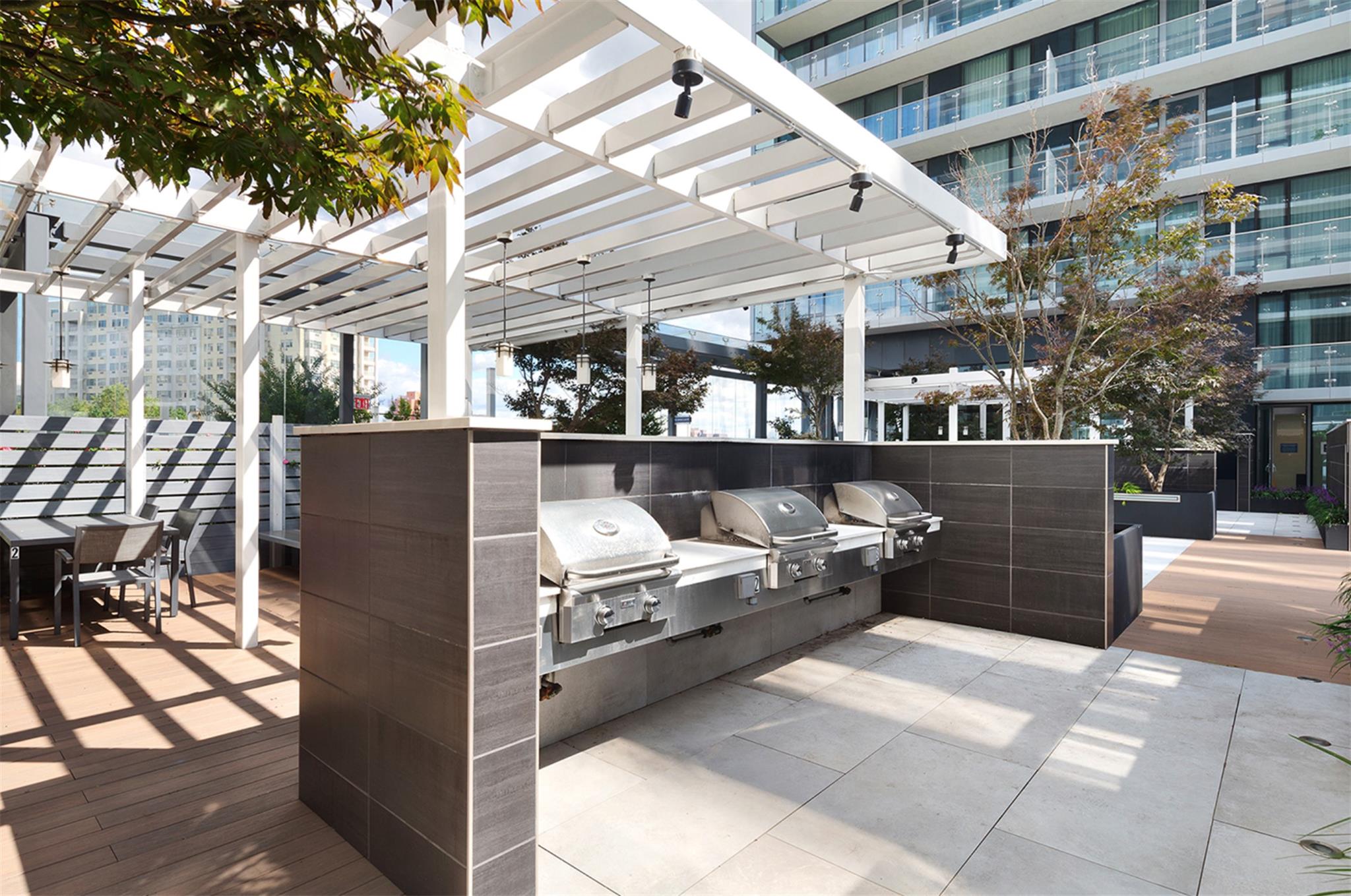 131-01 40 Road, Unit 11M Queens, NY 11354 - Photo 8 of 12 a view of a building with outdoor space