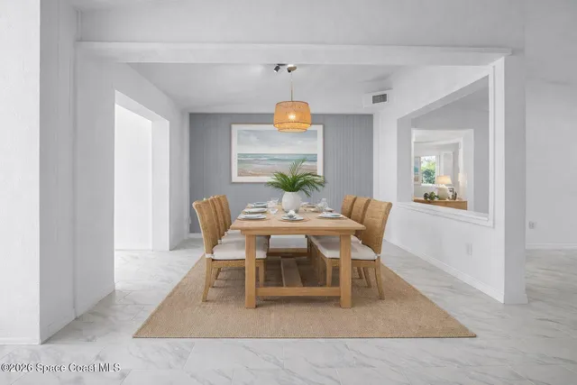 a view of an empty room with window and closet area