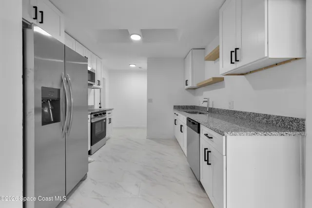 a view of a room with an empty space