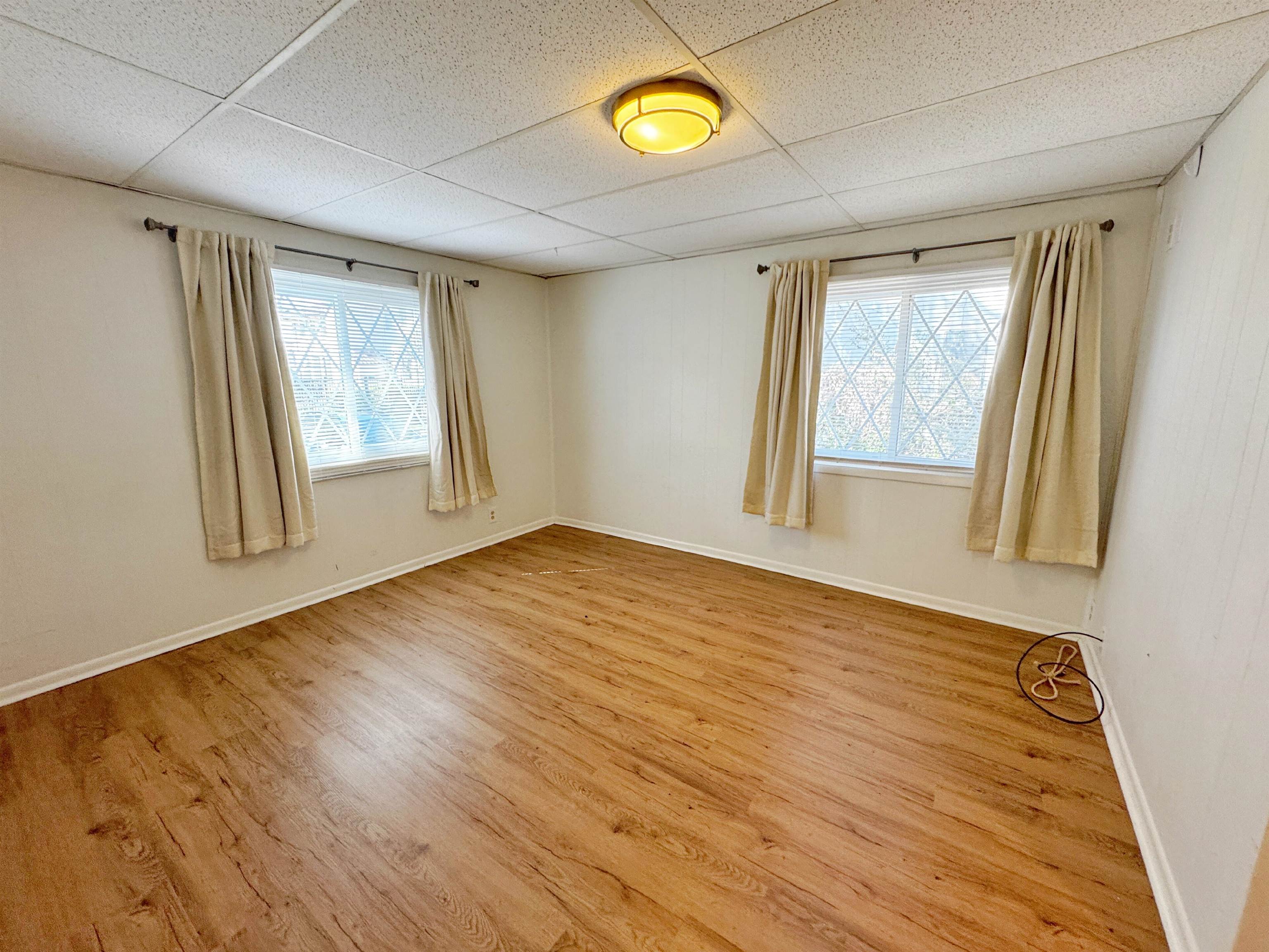 20 Macaris Street St. Augustine, FL 32084 - Photo 11 of 29 a view of an empty room with wooden floor and a window