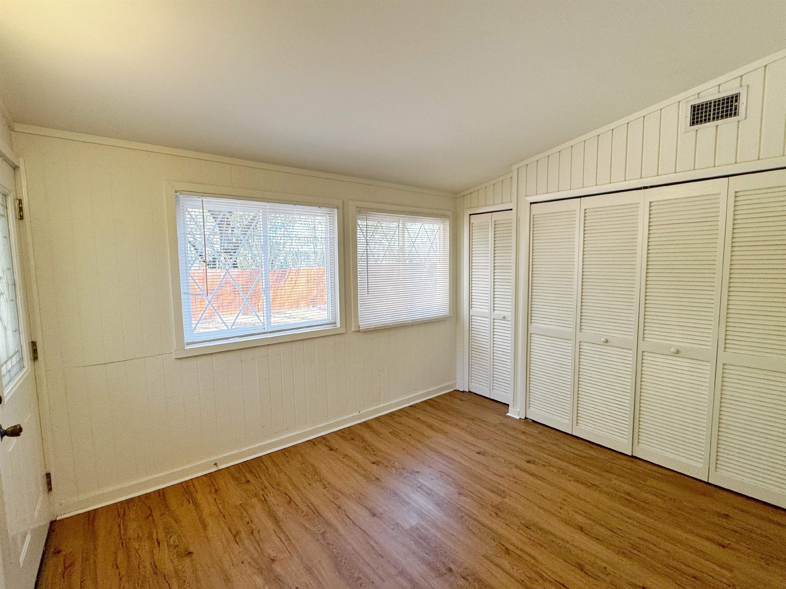 20 Macaris Street St. Augustine, FL 32084 - Photo 15 of 29 a view of an empty room with wooden floor and a window