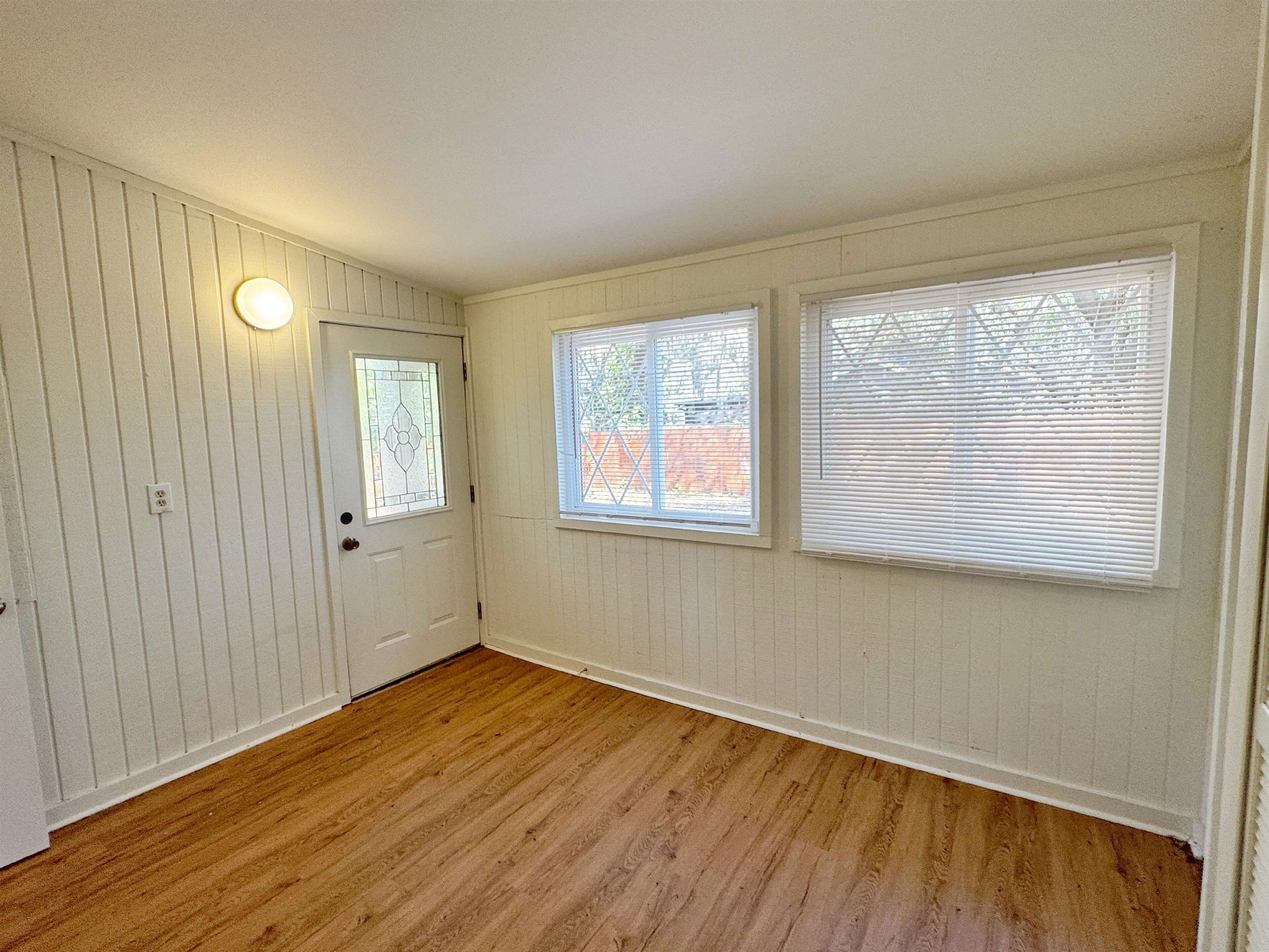 20 Macaris Street St. Augustine, FL 32084 - Photo 16 of 29 a view of an empty room with wooden floor and a window
