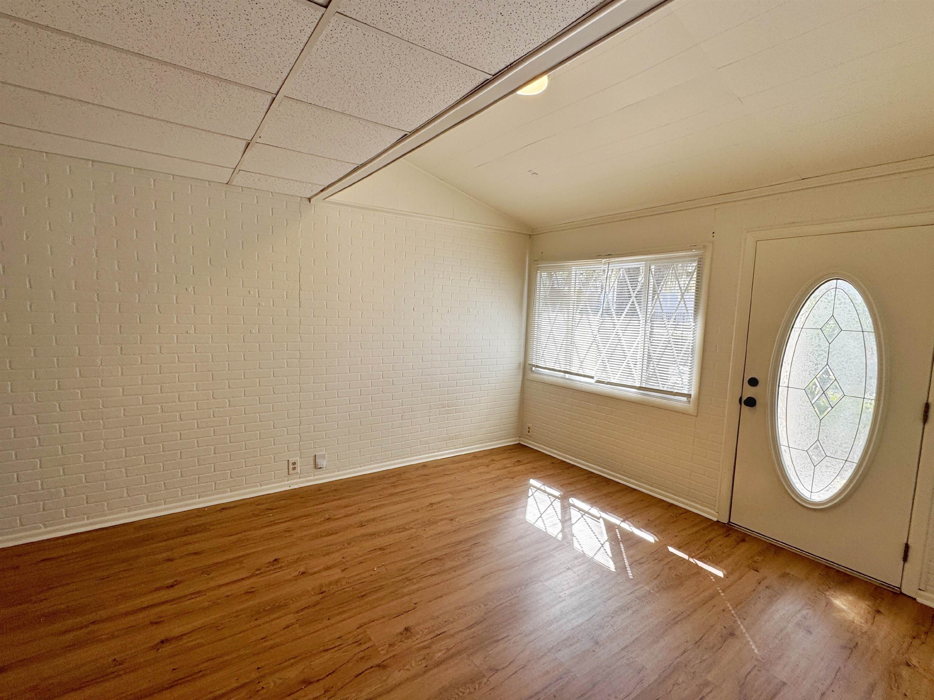 20 Macaris Street St. Augustine, FL 32084 - Photo 18 of 29 an empty room with wooden floor and windows