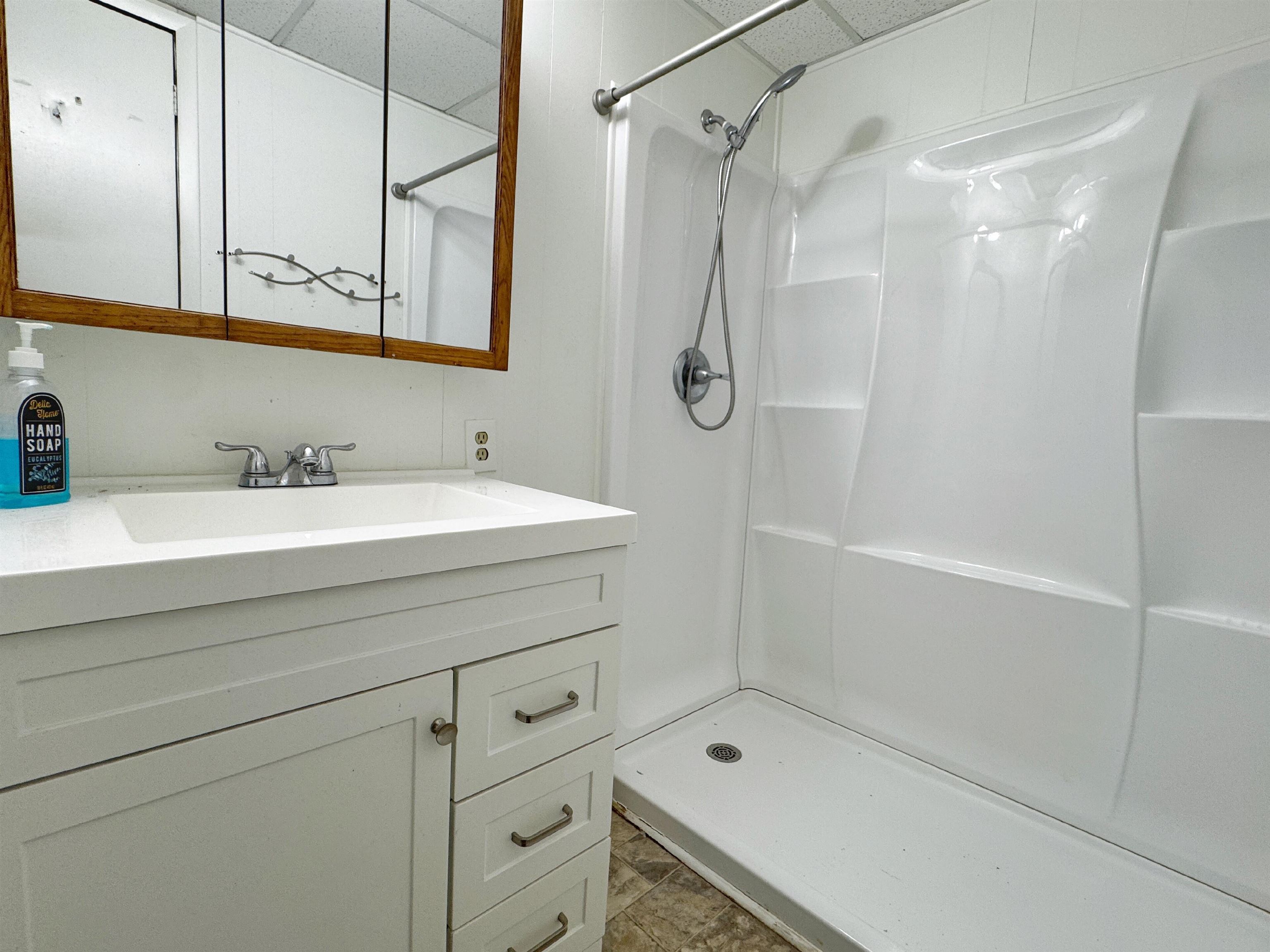 20 Macaris Street St. Augustine, FL 32084 - Photo 20 of 29 a bathroom with a sink and a shower