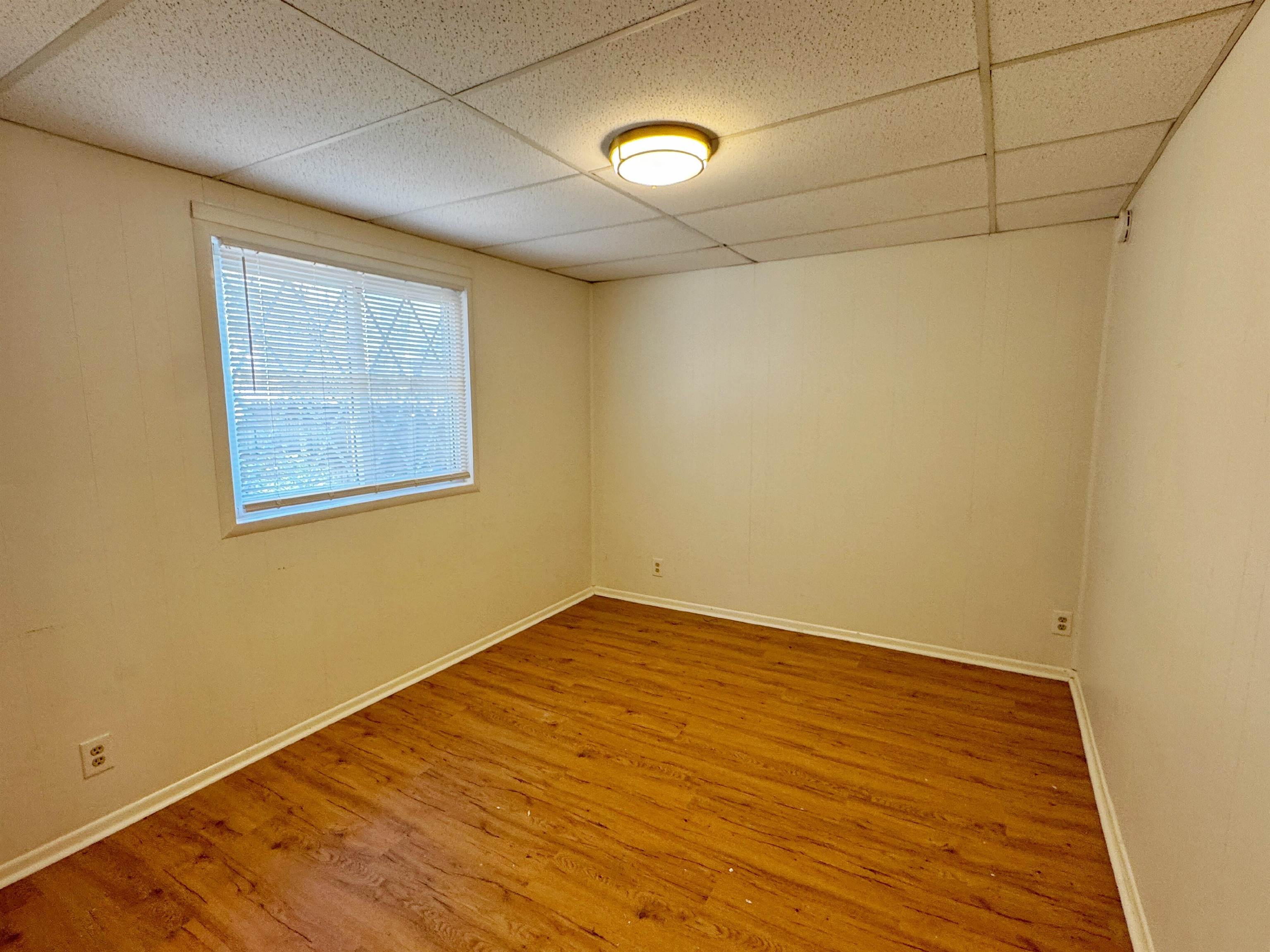 20 Macaris Street St. Augustine, FL 32084 - Photo 22 of 29 an empty room with wooden floor and windows
