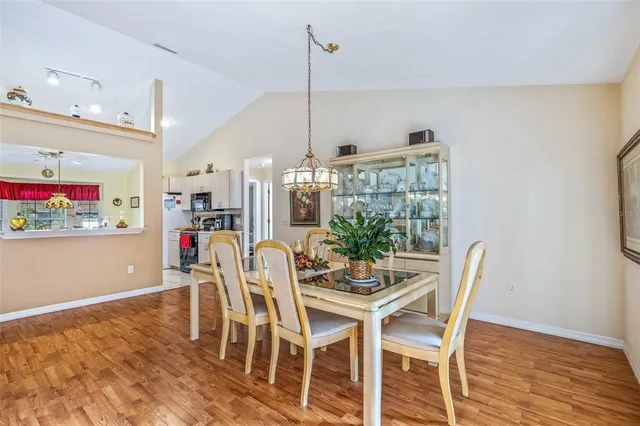 a dining room with furniture and window