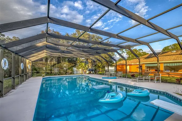 a view of a swimming pool with a patio