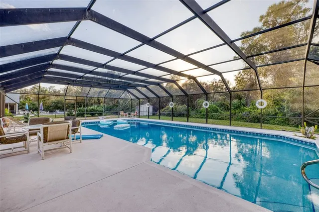 a view of a swimming pool with a patio