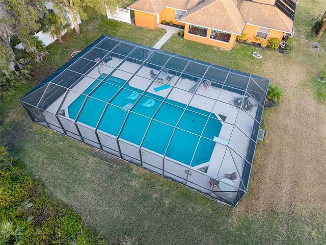 a view of a backyard with a tree