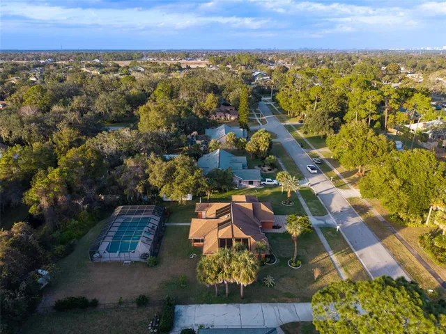 an aerial view of residential house with outdoor space