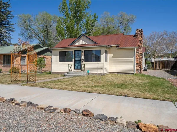 front view of a house with a yard