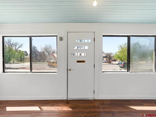 a view of a room that has a large window
