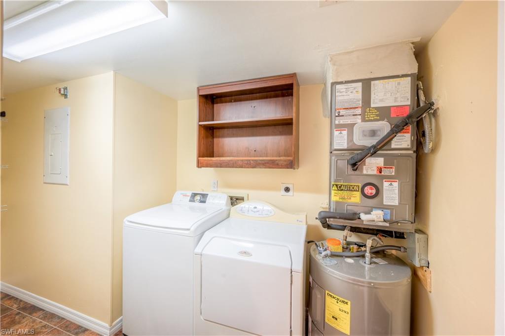 5685 Whitaker Road, Unit C101 Naples, FL 34112 - Photo 17 of 22 a utility room with dryer and washer