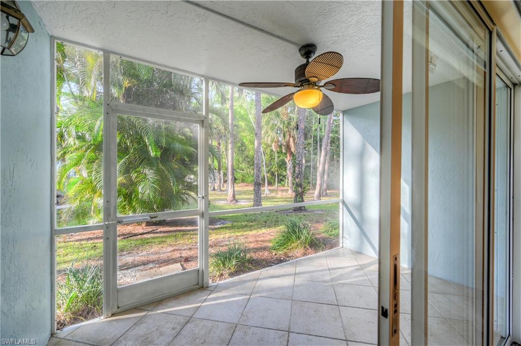 5685 Whitaker Road, Unit C101 Naples, FL 34112 - Photo 20 of 22 a view of backyard from a window