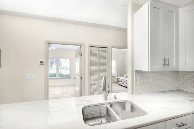 a kitchen with stainless steel appliances a refrigerator stove and microwave