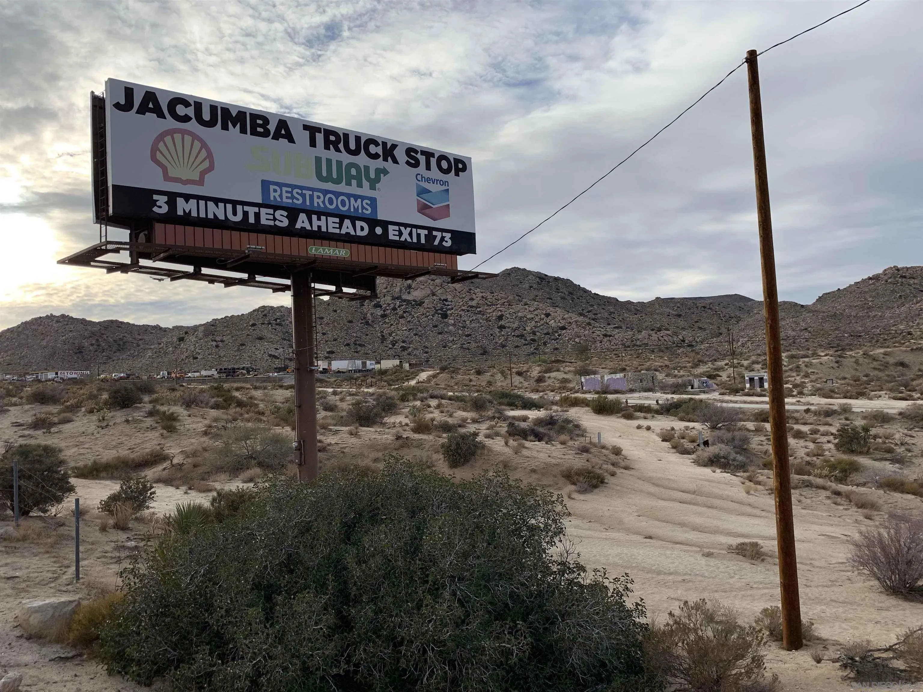 a sign on the side of a road
