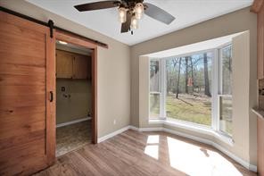 10235 White Rock Road Conroe, TX 77306 - Photo 14 of 25 a view of hallway with chandelier and glass door