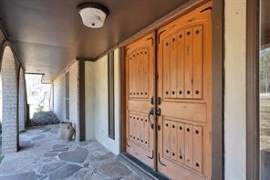 10235 White Rock Road Conroe, TX 77306 - Photo 18 of 25 a view of a hallway with wooden floor