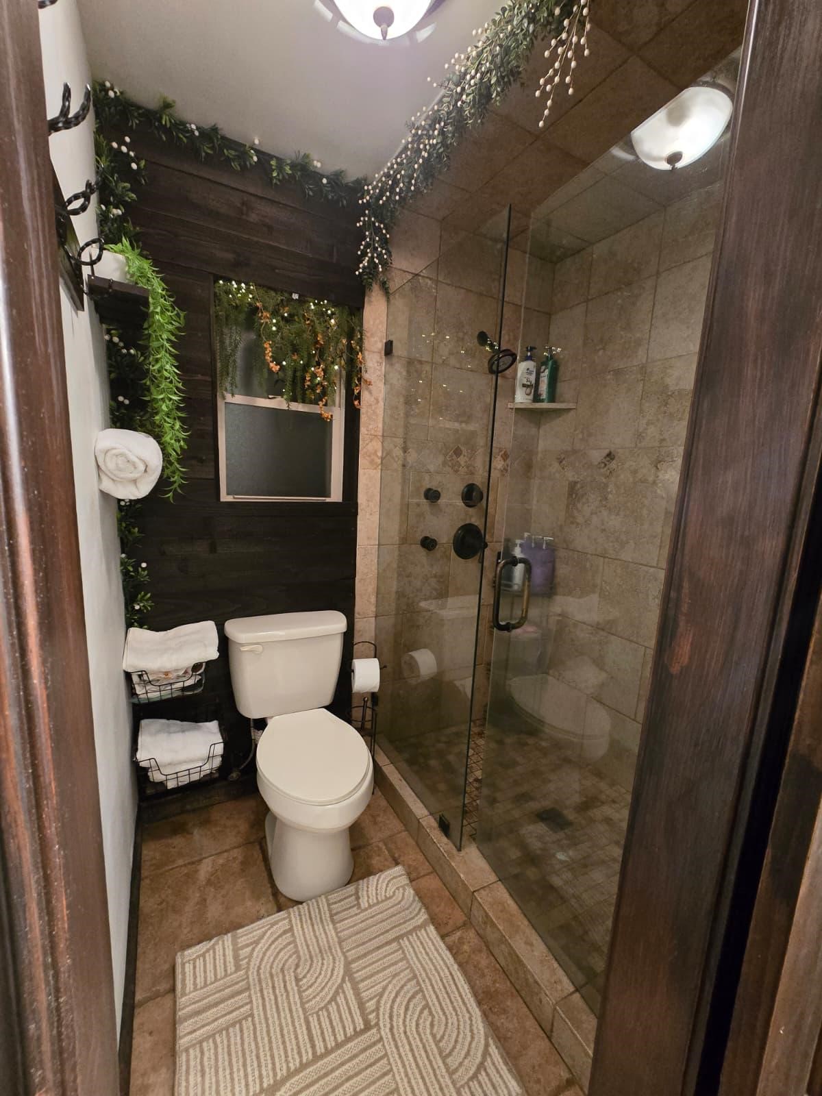 10235 White Rock Road Conroe, TX 77306 - Photo 21 of 25 a bathroom with a toilet and a shower