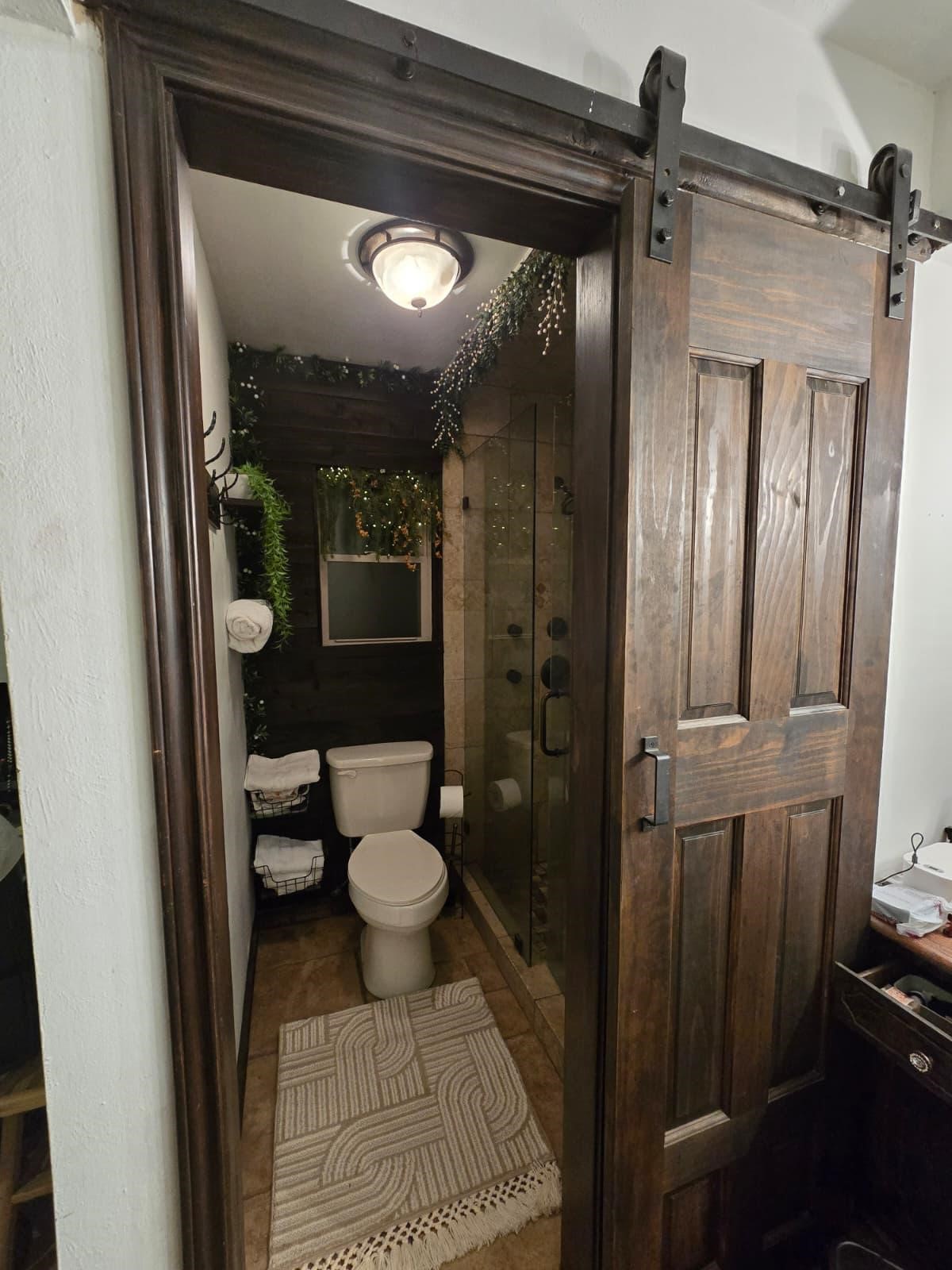 10235 White Rock Road Conroe, TX 77306 - Photo 22 of 25 a bathroom with a toilet a sink and shower