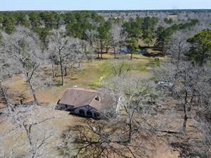 10235 White Rock Road Conroe, TX 77306 - Photo 25 of 25 a view of a yard with large trees