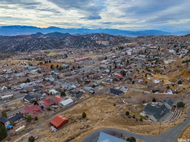 an aerial view of house with yard