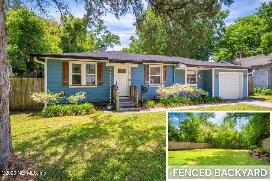 a front view of house with yard and green space