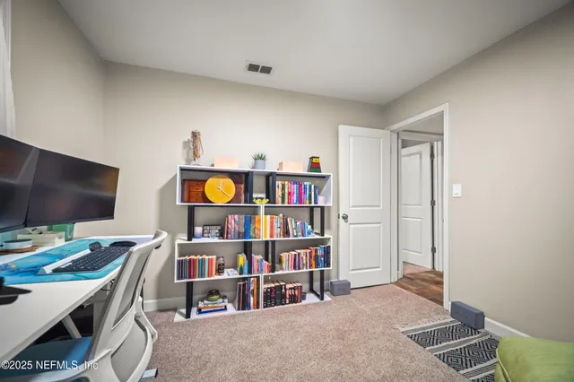 a view of a workspace with furniture