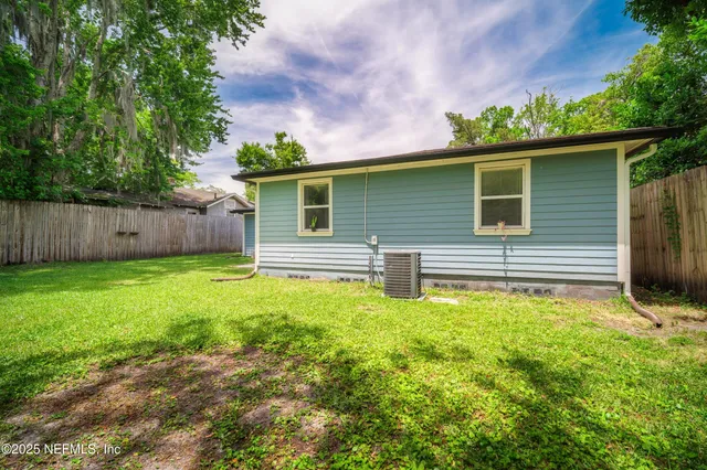 a backyard of a house with lots of green space