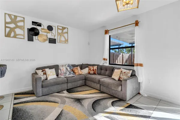 a living room with furniture and a window