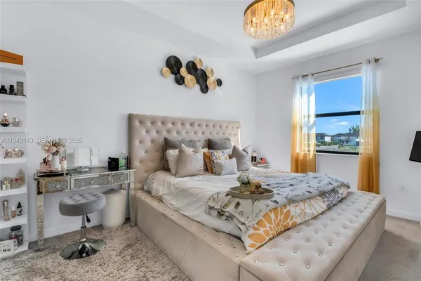a bedroom with a bed and a table in it
