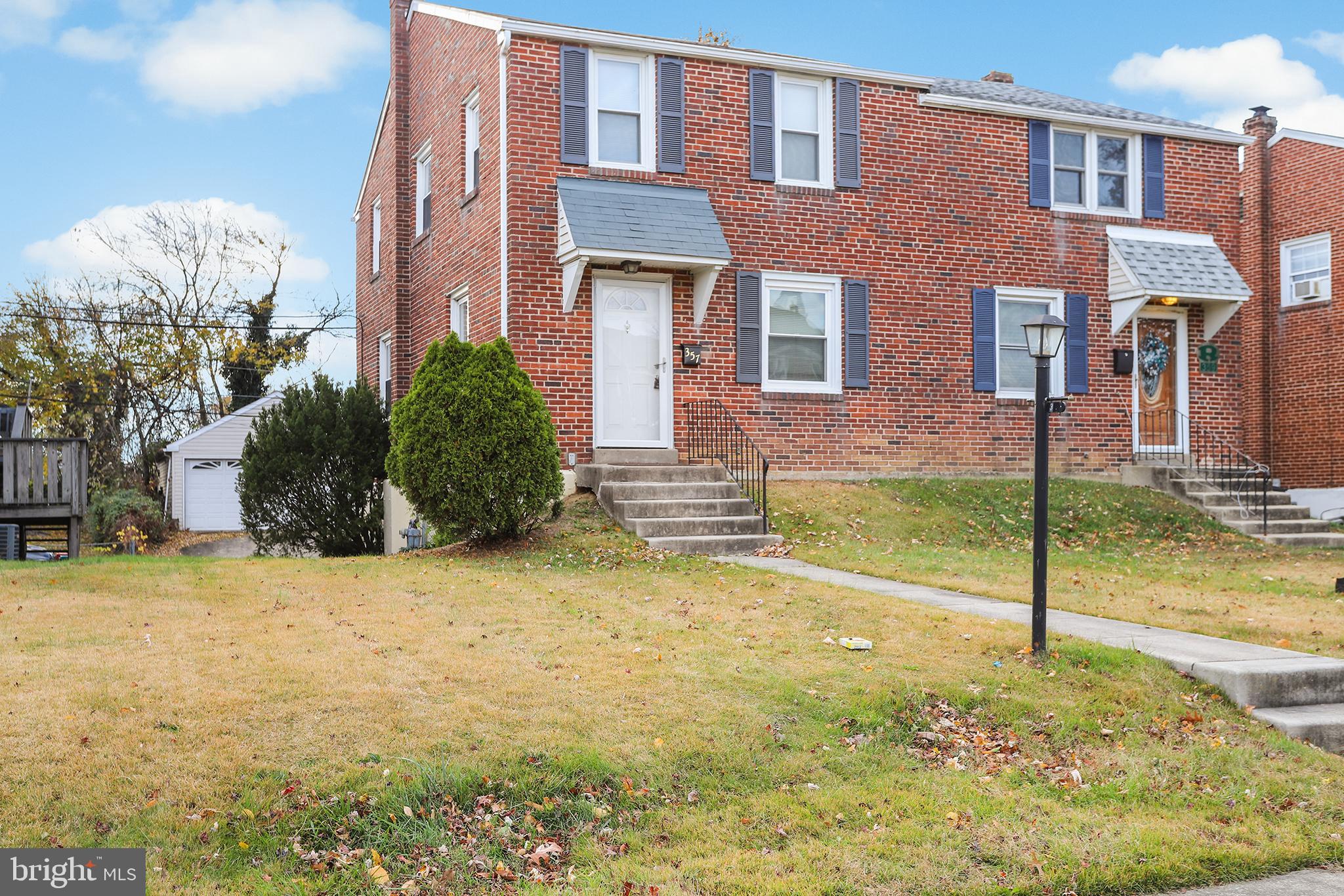 357 Cedar Avenue Holmes, PA 19043 - Photo 1 of 20 a view of a brick house next to a yard