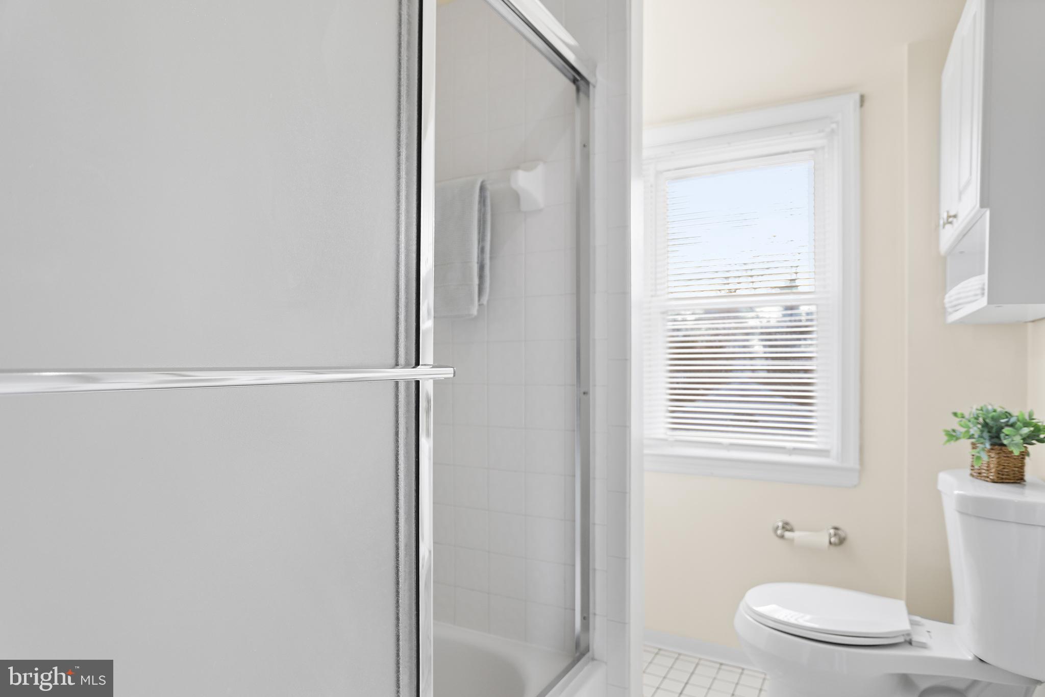 357 Cedar Avenue Holmes, PA 19043 - Photo 16 of 20 a bathroom with a toilet a sink and a window