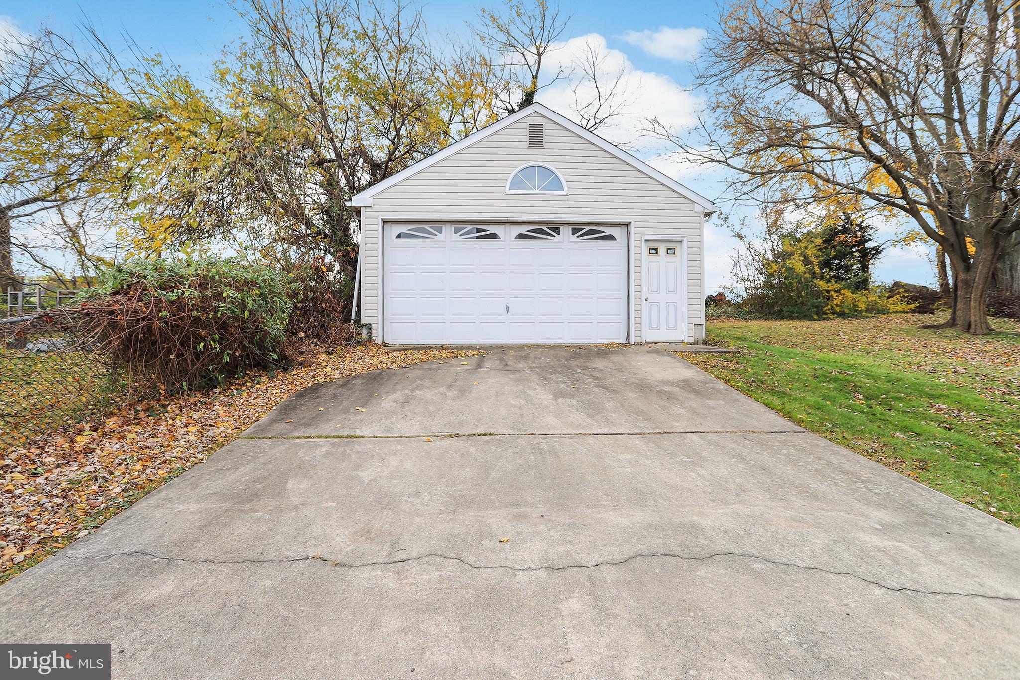 357 Cedar Avenue Holmes, PA 19043 - Photo 17 of 20 a front view of a house with a yard and garage