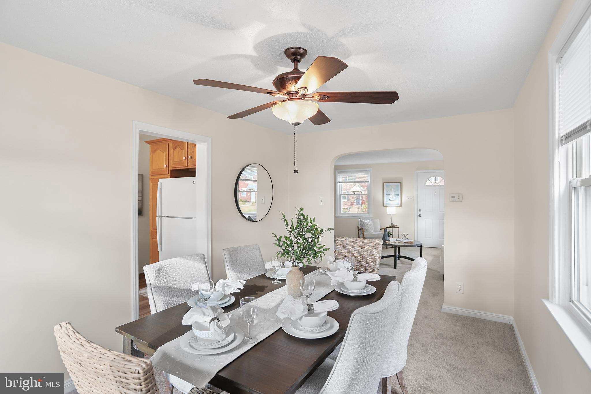 357 Cedar Avenue Holmes, PA 19043 - Photo 6 of 20 a dining room with furniture a chandelier fan and a window