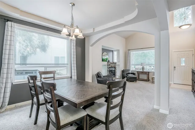 a view of a dining room with furniture window and outside view