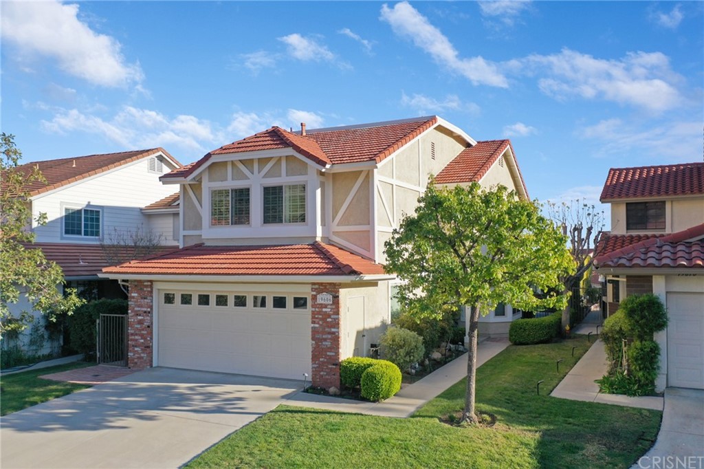 19606 Eagle Ridge Lane Porter Ranch, CA 91326 - Photo 1 of 1 a front view of a house with a yard and garage