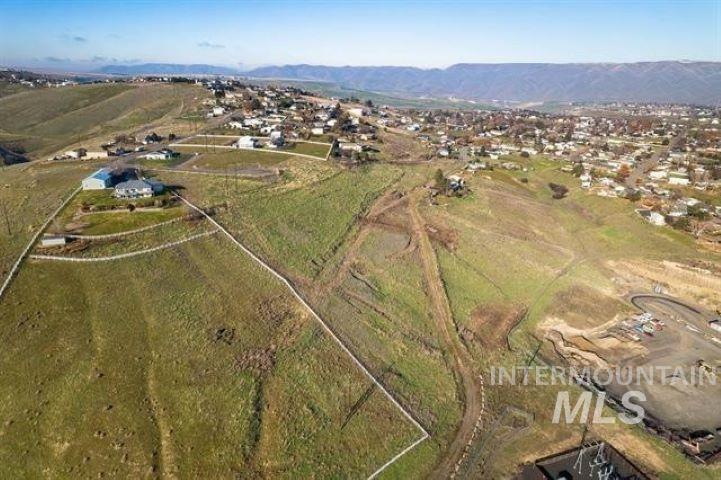 2662 South Slope Lane Clarkston, WA 99403 - Photo 8 of 18 Aerial view of property and surrounding area featuring rural landscape and a mountain backdrop