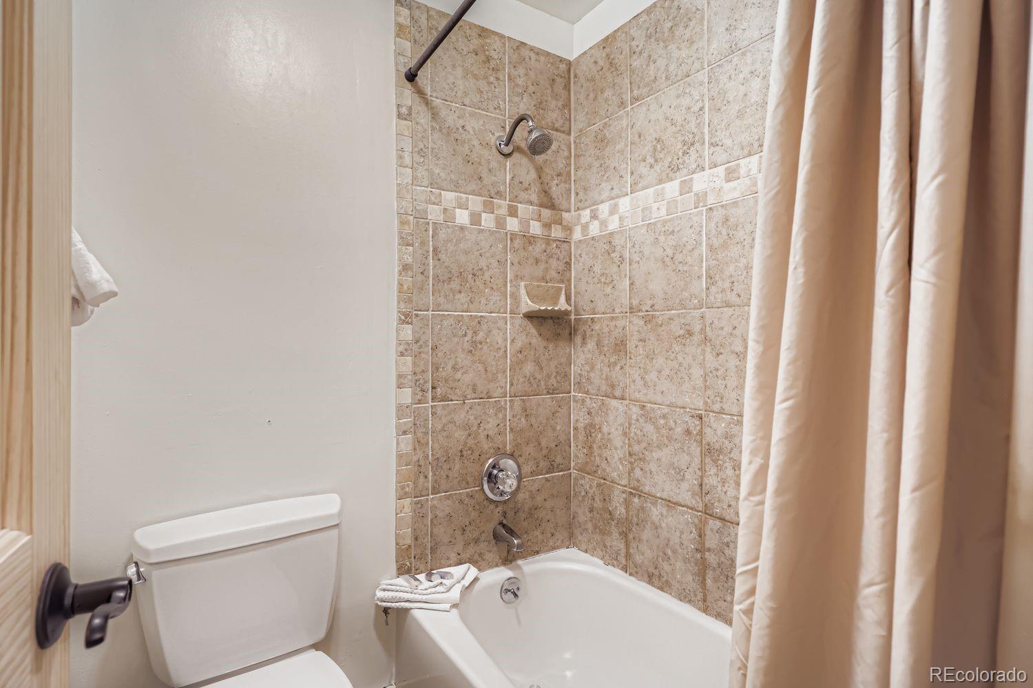 6916 Ryan Gulch Road, Unit 6916 Silverthorne, CO 80498 - Photo 20 of 33 a bathroom with a sink and toilet
