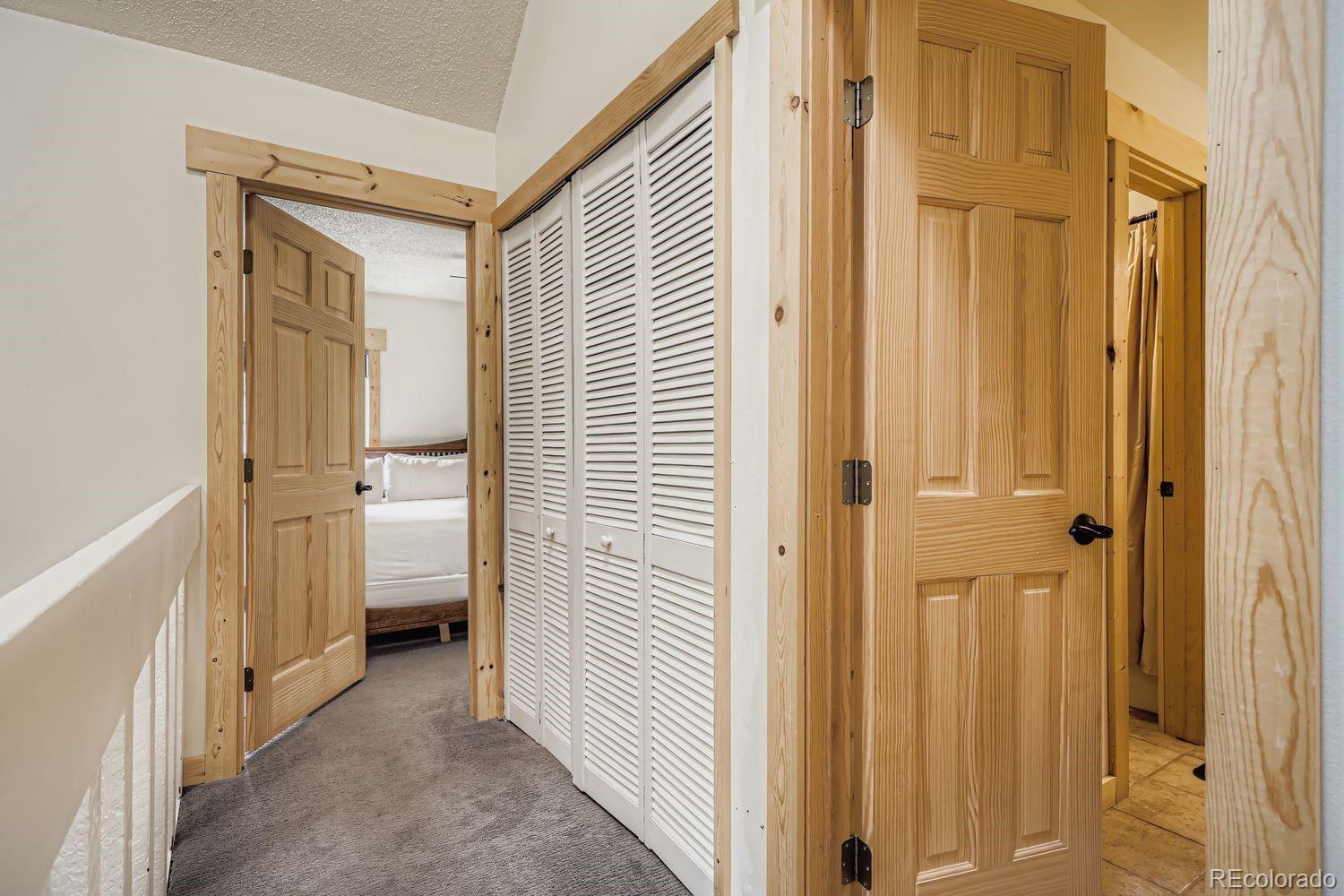 6916 Ryan Gulch Road, Unit 6916 Silverthorne, CO 80498 - Photo 23 of 33 a view of a bathroom with a sink and mirror