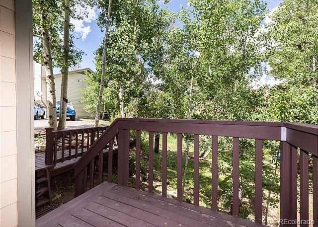 6916 Ryan Gulch Road, Unit 6916 Silverthorne, CO 80498 - Photo 26 of 33 a view of a balcony with wooden floor