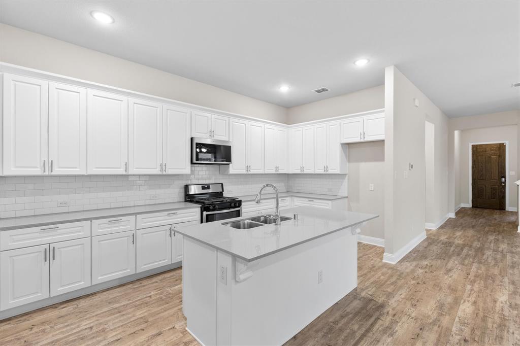 576 Spruce Trail Forney, TX 75126 - Photo 7 of 39 with Quartz countertops & walk-in pantry