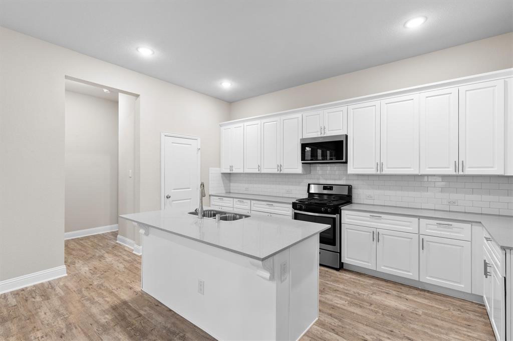 576 Spruce Trail Forney, TX 75126 - Photo 8 of 39 with Quartz countertops & walk-in pantry