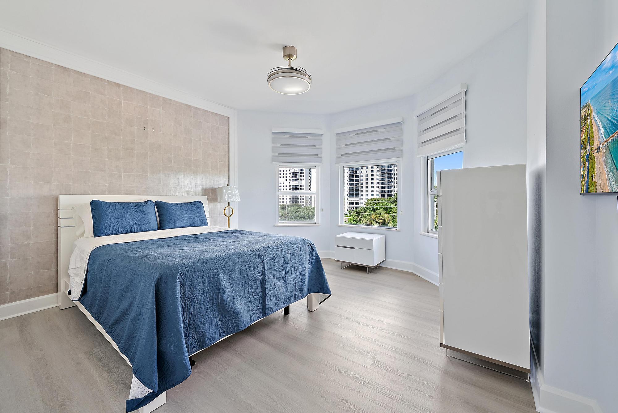 Undisclosed Address Boca Raton, FL 33431 - Photo 30 of 47 a spacious bedroom with a bed and a couch