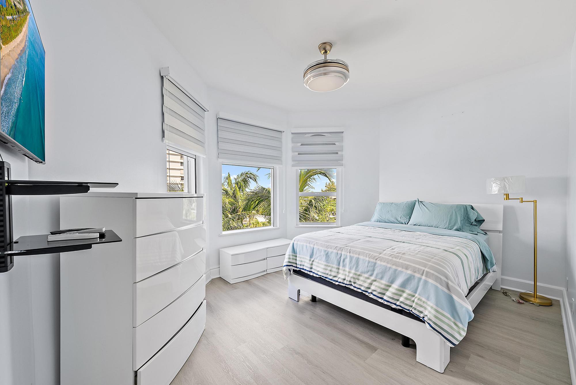 Undisclosed Address Boca Raton, FL 33431 - Photo 32 of 47 a bedroom with a bed windows and garden