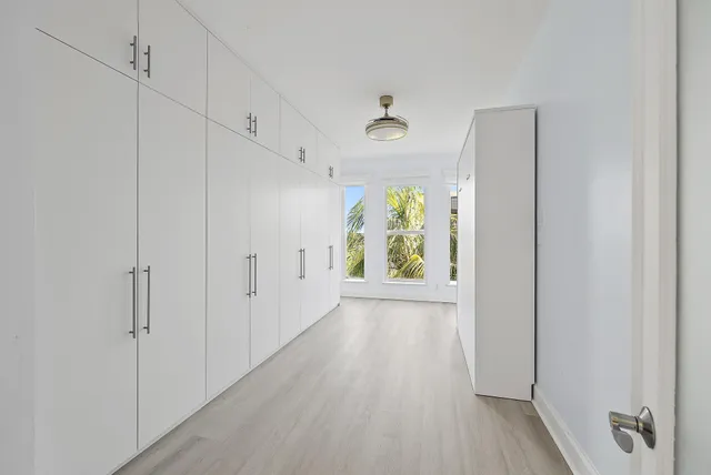 a view of an entryway with wooden floor