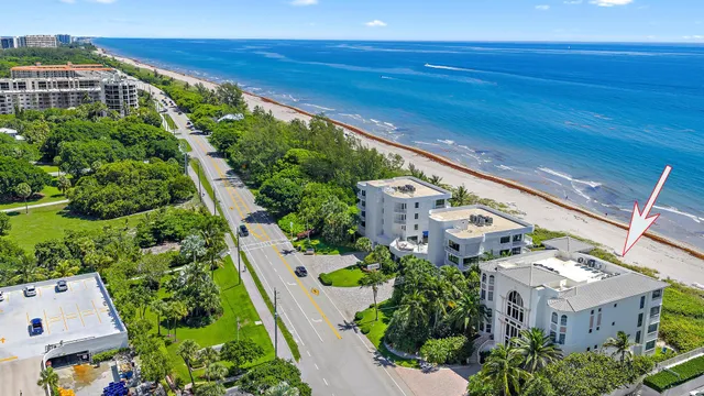 an aerial view of multiple houses with yard