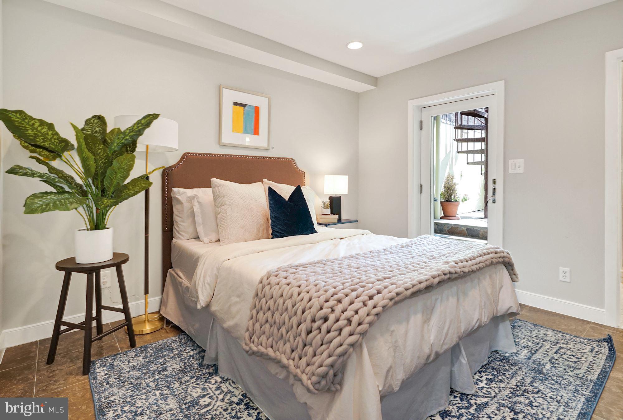 1830 Corcoran Street Northwest Washington, DC 20009 - Photo 3 of 20 Main level bedroom suite leads to back patio